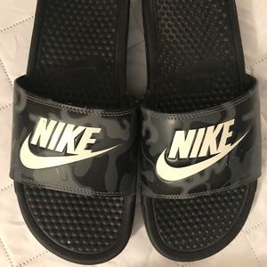 Grey camo Nike benassi slides.